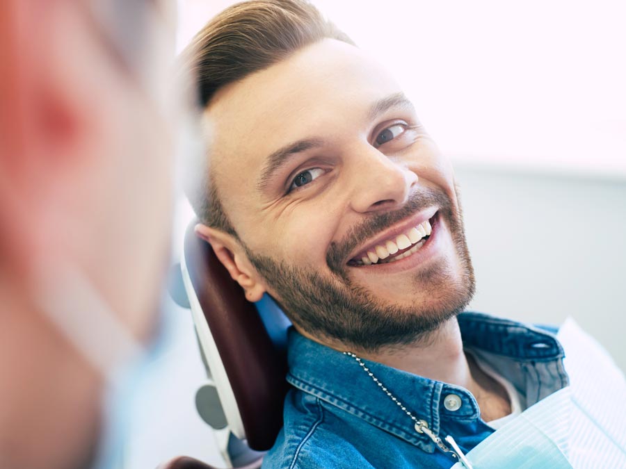 man smiling in dentist chair